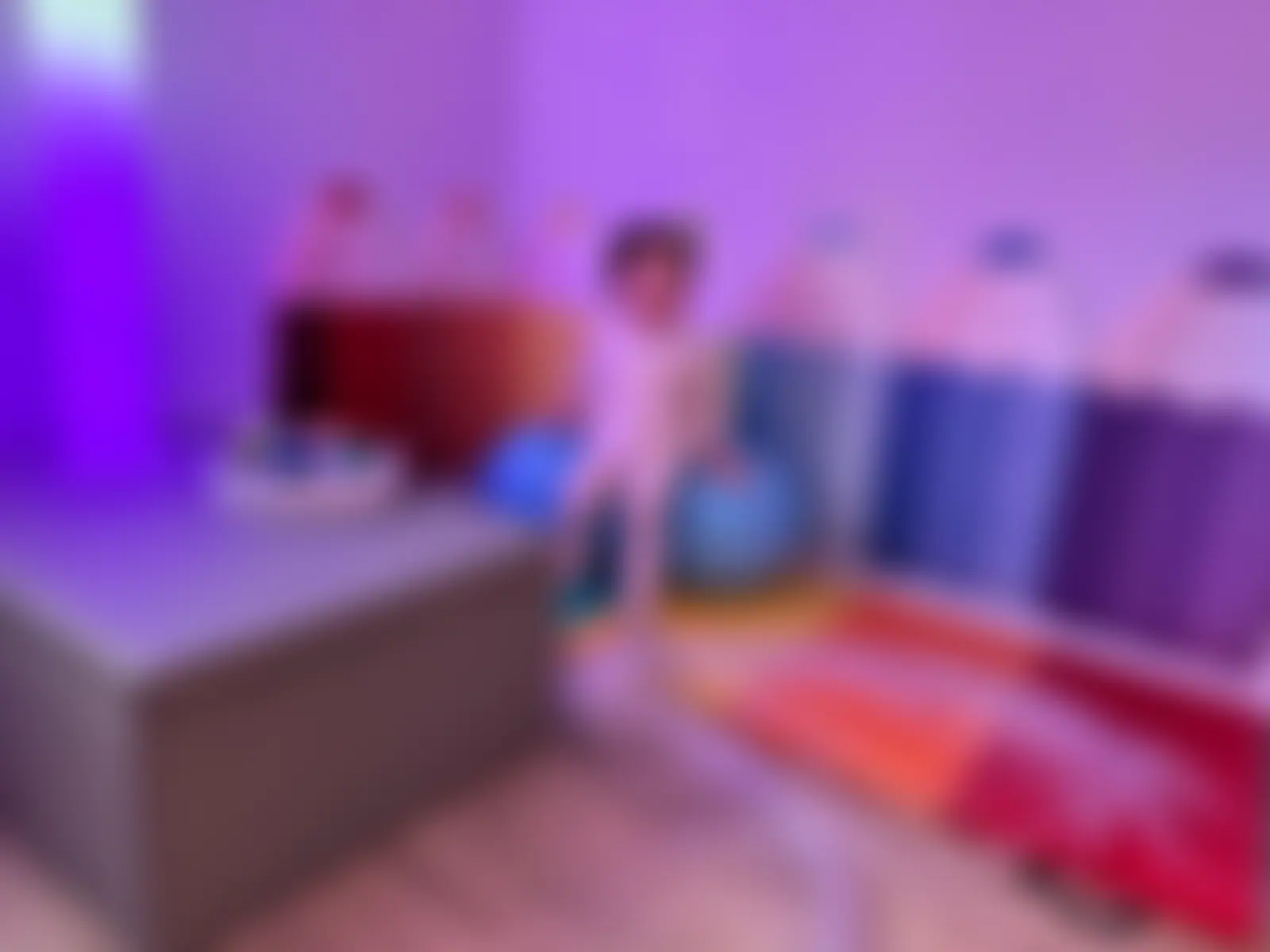 Child using the big-button switch panel in the sensory room