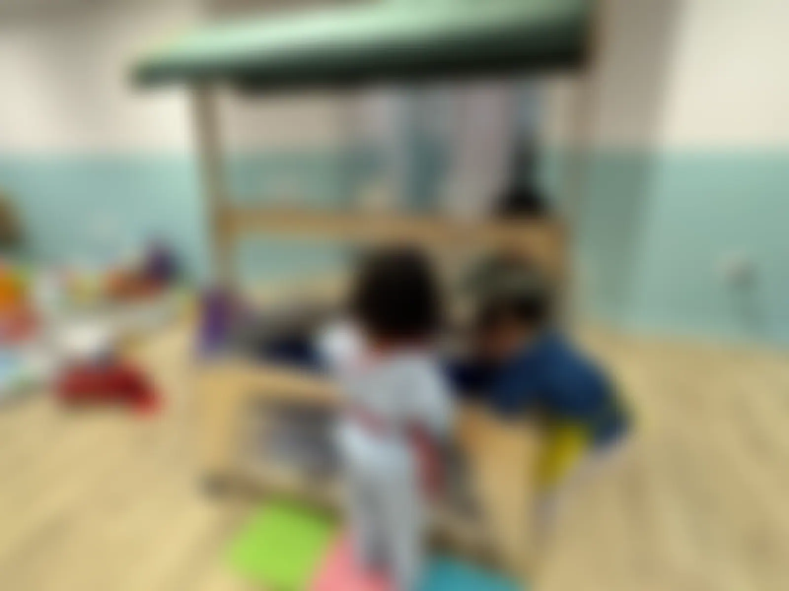 Two children sharing the water-play unit